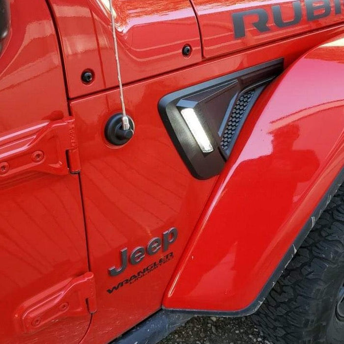 Close-up of Sidetrack™ LED Lighting System installed on a Jeep, with white LEDs on.