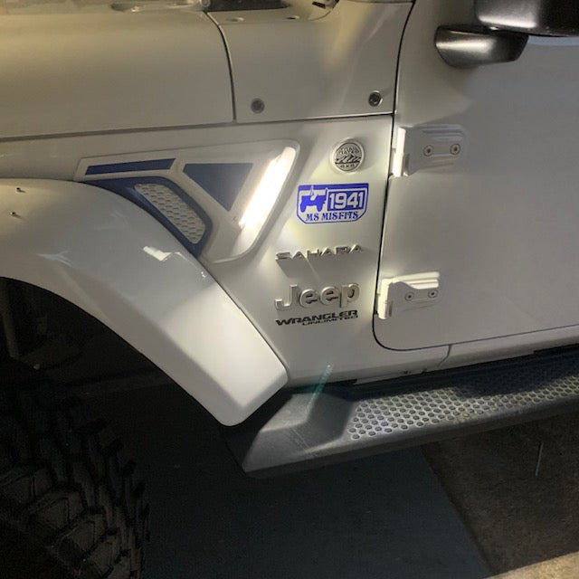 Close-up of Sidetrack™ LED Lighting System installed on a Jeep, with white LEDs on.