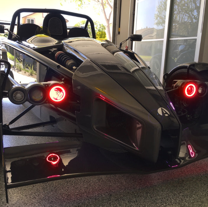 Ariel Atom with red headlight halos.