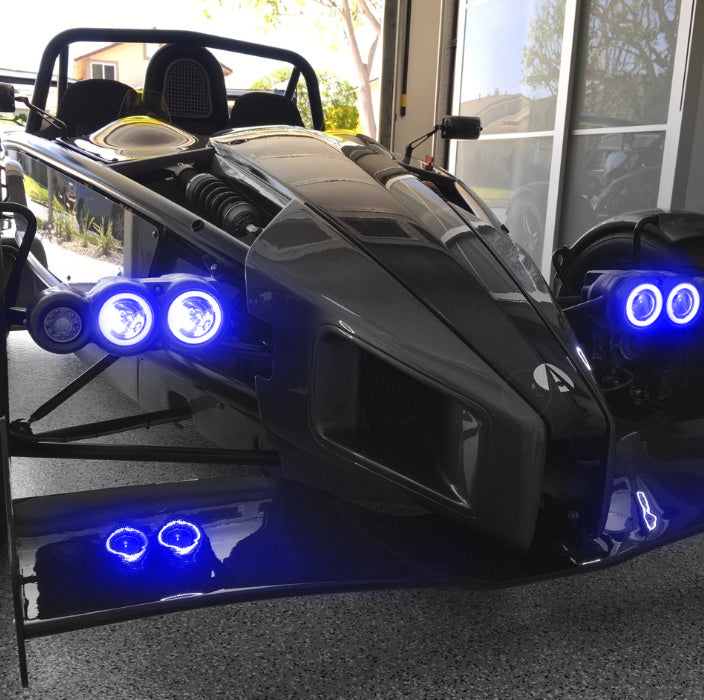 Ariel Atom with blue headlight halos.