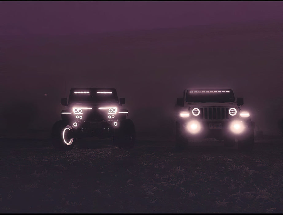 Two Jeeps side by side with multiple LED lighting products installed.