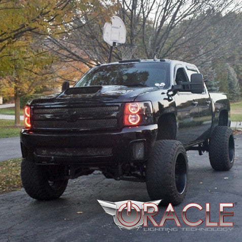 Three quarters view of a Chevrolet Silverado with amber LED headlight halo rings installed.