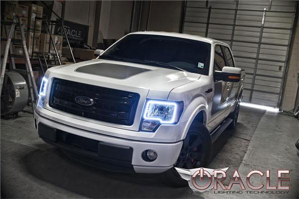 Front end of a Ford F-150 with white LED headlight halo rings.