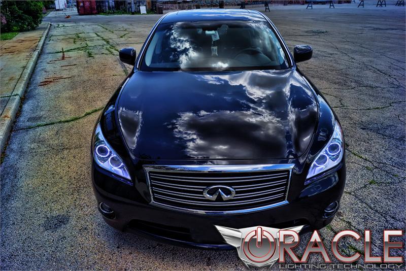 Front end of an Infiniti M37 with white LED headlight halo rings.