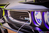 Close-up on the grille of a Dodge Challenger, with white LED headlight halo rings installed.