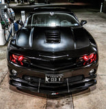 Front end of a Chevrolet Camaro with red LED headlight halo rings installed.