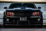 Front end of a Chevrolet Camaro with red LED headlight halo rings installed.