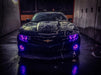 Chevrolet Camaro going through a car wash with purple LED headlight and fog light halo rings installed.