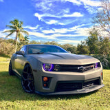 Three quarters view of a Chevrolet Camaro with purple LED headlight halo rings installed.