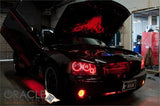 Black charger in a garage with hood and doors open and red LED lighting accents.