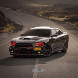 Three quarters view of a black Dodge Charger with red LED headlight halo rings installed.