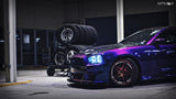 Front end of a Dodge Charger with white LED headlight halo rings installed.