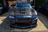 Front end of a Dodge Charger with white LED headlight halo rings installed.