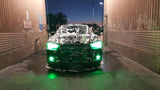 Front end of a Dodge Charger with green LED headlight and fog light halo rings installed.