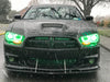 Front end of a black Dodge Charger with green LED headlight halo rings installed.