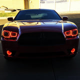 Front end of a Dodge Charger with red LED headlight and fog light halo rings installed.