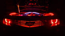 Front end of a Chevrolet Camaro with red LED engine bay lighting.