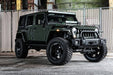 Three quarters view of a Jeep Wrangler JK with LED Off-Road Side Mirrors installed.