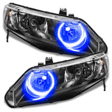 Honda Civic headlights with blue halo rings.