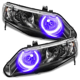 Honda Civic headlights with purple halo rings.