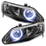 Honda Civic headlights with white halo rings.