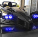 Ariel Atom with blue headlight halos.