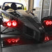 Ariel Atom with red headlight halos.