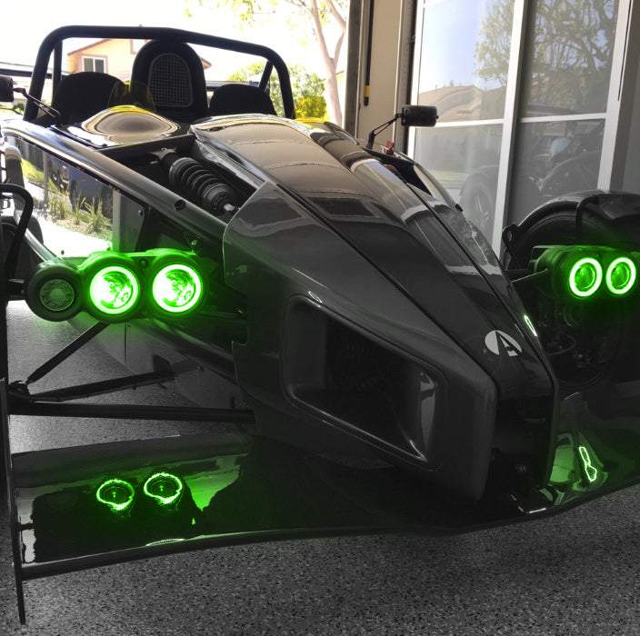 Ariel Atom with green headlight halos.