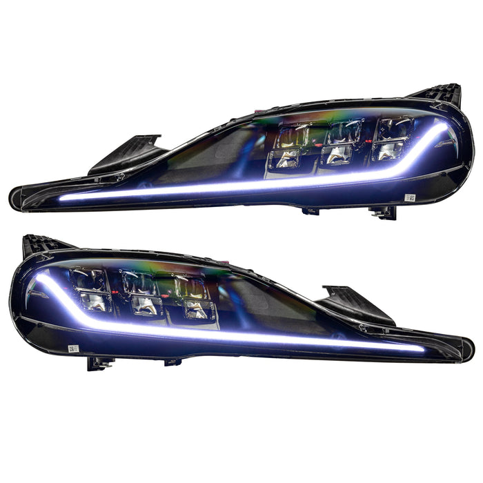 Toyota Supra headlights with white DRLs.