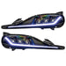 Toyota Supra headlights with white DRLs.