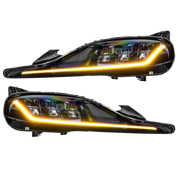 Toyota Supra headlights with yellow DRLs.