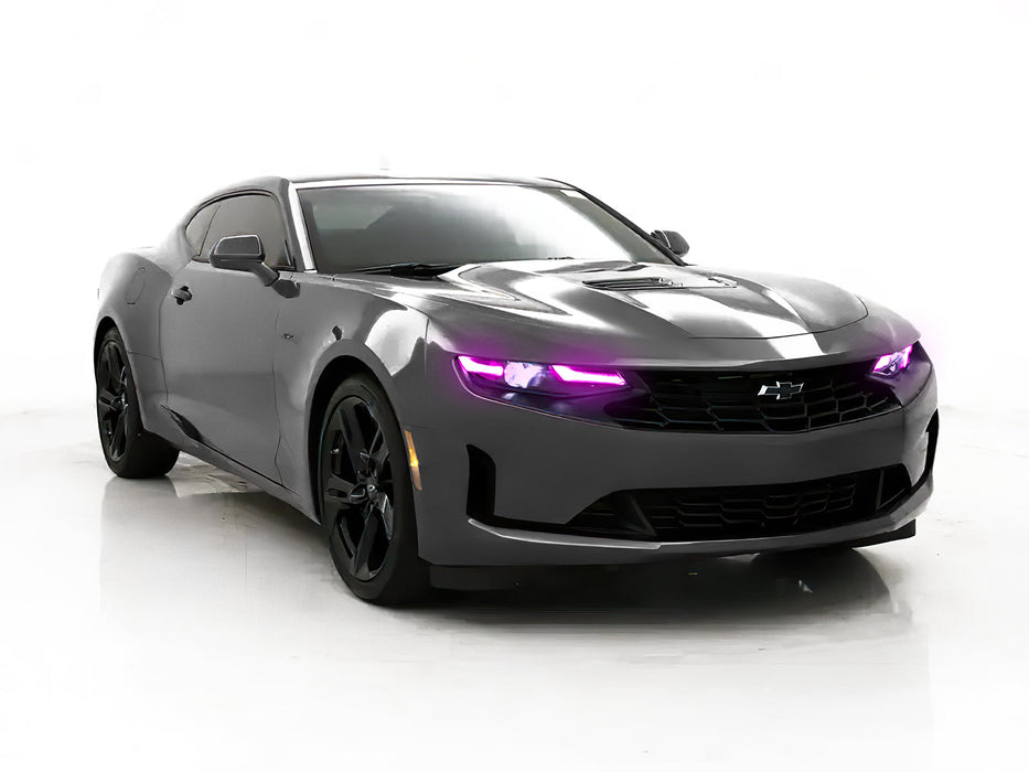 Three quarters view of a Chevrolet Camaro with pink headlight DRLs.