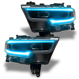 Ram 1500 headlights with cyan DRLs.