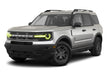 Three quarters view of a Ford Bronco Sport with yellow headlight halos and DRLs.