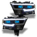 Ram 1500 headlights with cyan demon eye projectors.
