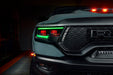Close-up of Ram 1500 headlights with green DRLs and red demon eye projectors.
