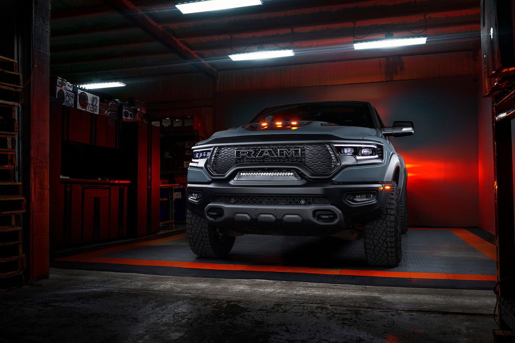 Front view of a Ram 1500 with white headlight DRLs and white demon eye projectors.