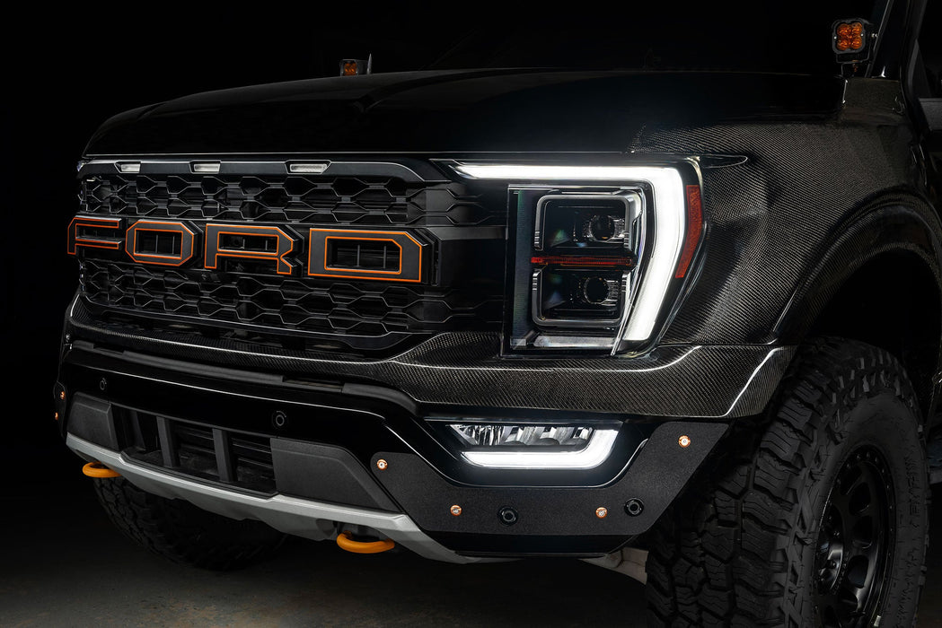 Front end of a Ford F-150 with white headlight DRLs