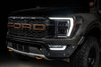 Front end of a Ford F-150 with white headlight DRLs