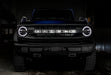 Front view of a Ford Bronco with white halo headlights.