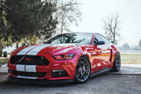 Three quarters view of a Ford Mustang with red headlight halos and DRLs installed.