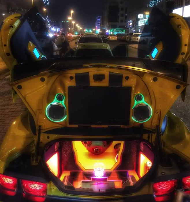 Camaro with doors open and LED lighting inside.