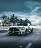 Three quarters view of a Ford Mustang with yellow headlight halos and DRLs.