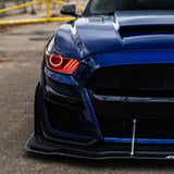 Front end of a Ford Mustang with red headlight halos and DRLs.
