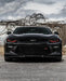 Front end of a black Chevrolet Camaro with red headlight DRLs.