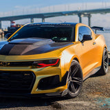 Three quarters view of a Chevrolet Camaro with red headlight DRLs.