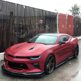 Three quarters view of a red Chevrolet Camaro with cyan headlight DRLs.