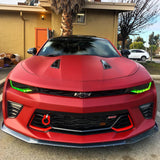 Front end of a Chevrolet Camaro with green headlight DRLs.