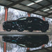 Black Camaro with cyan DRLs.