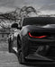 Black Camaro with red DRLs.